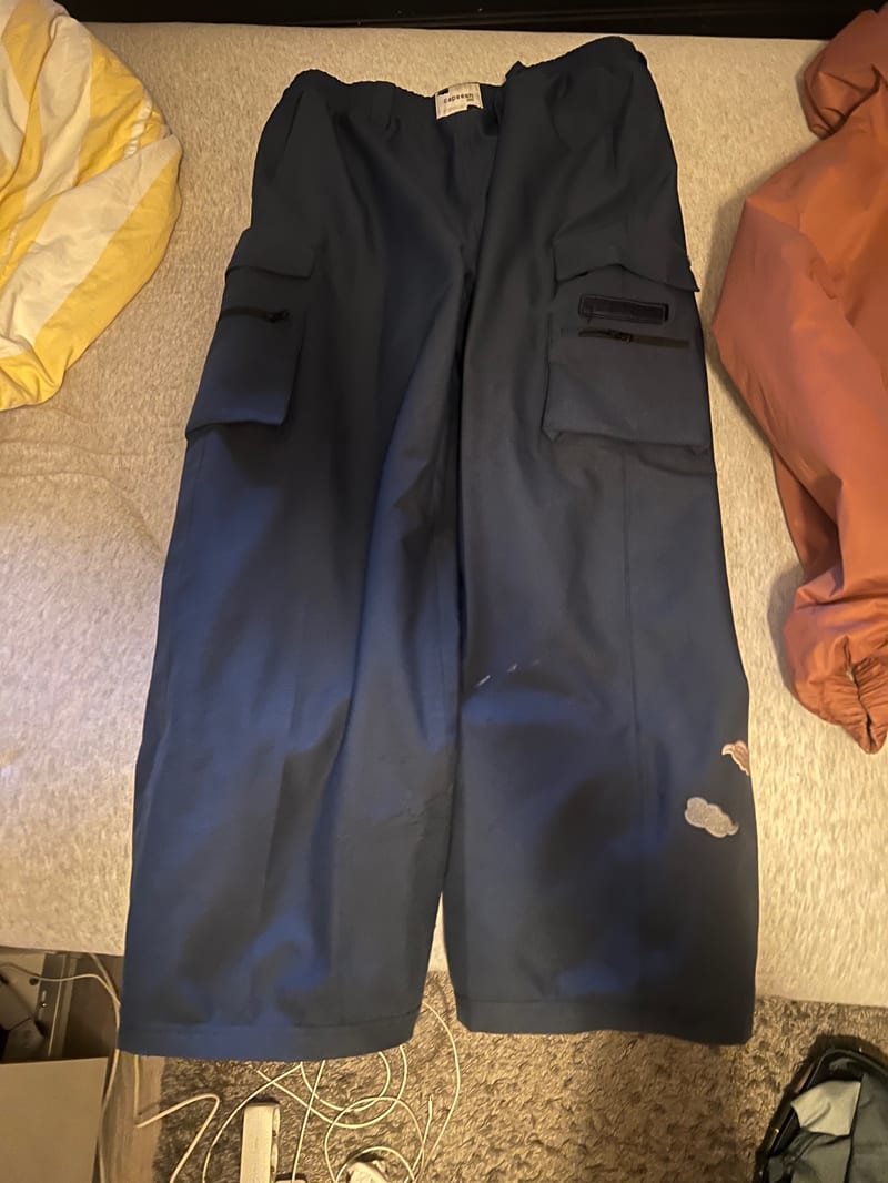 Navy blue cargo trousers with cloud patches